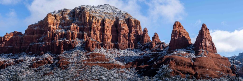 Snow covers Sedona red rocks on a sunny winter day